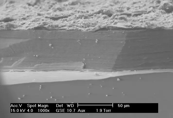 Scanning Electron Microscope (SEM) Images – SEM image of the corrosion layer on the surface of an ancient glass fragment; note the laminar structure of the corrosion layer.