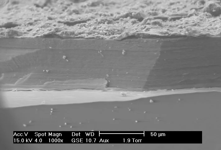 Scanning Electron Microscope (SEM) Images – SEM image of the corrosion layer on the surface of an ancient glass fragment; note the laminar structure of the corrosion layer.